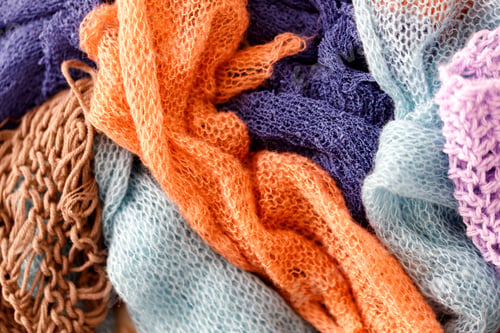 Preview: Knitting Wool Texture. Background texture of pattern knitted fabric made of cotton or wool closeup