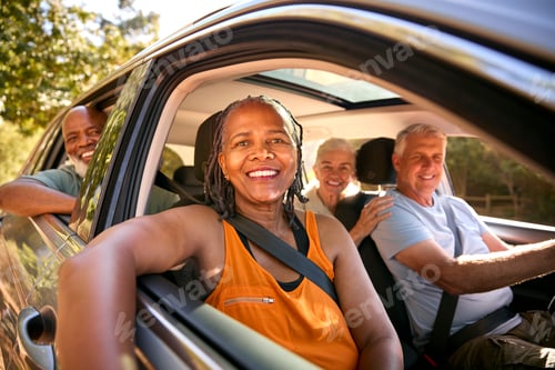 Preview: Portrait Of Group Of Senior Friends Enjoying Day Trip Out Driving In Car Together