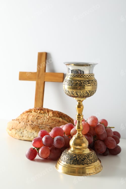 Preview: Bread, cup, grapes and wooden cross on white background