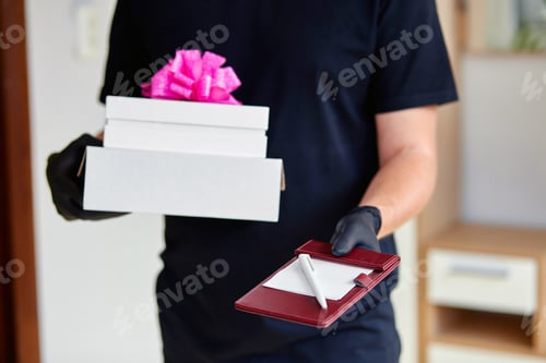 Preview: Delivery Man Delivering a Gift Box to Home
