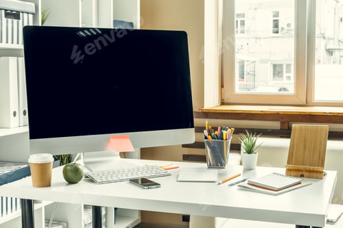 Preview: Office or home workspace. Computer monitor with black screen on office table with supplies