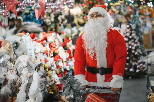 Preview: Santa claus man shopping for christmas decorations in store