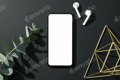 Preview: Phone with empty screen on black decorated background, top view