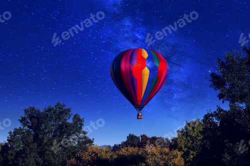 Preview: Colorful hot air balloon sliding across the night sky.