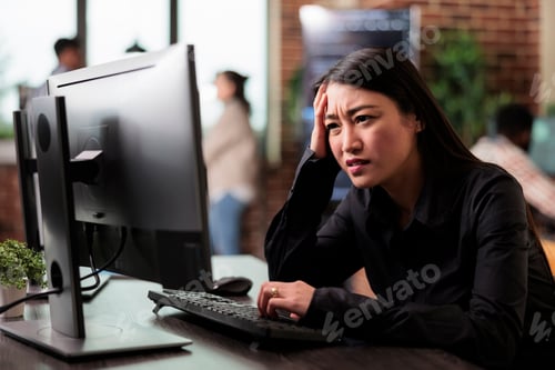 Preview: Doubtful asian computer engineer puzzled by nonfunctional security algorithm