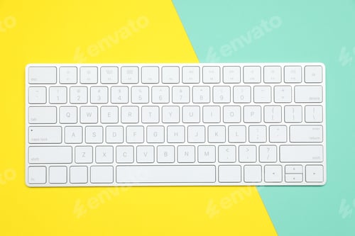 Preview: Modern white wireless keyboard on color background, top view