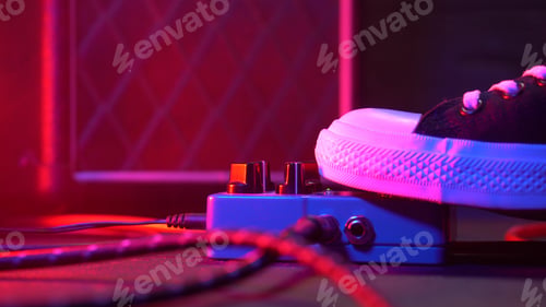 Preview: guitar player foot pressing pedal. Musician uses music effect loop machine. Man in trendy sneakers