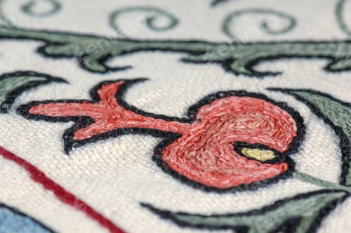 Preview: Closeup shot of national ornaments and patterns of Central Asia on a piece of cloth