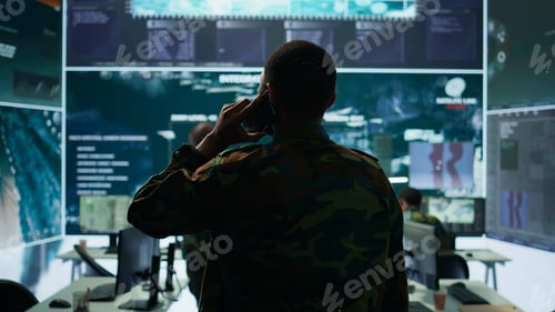 Preview: Military man answers phone call in a mission control center