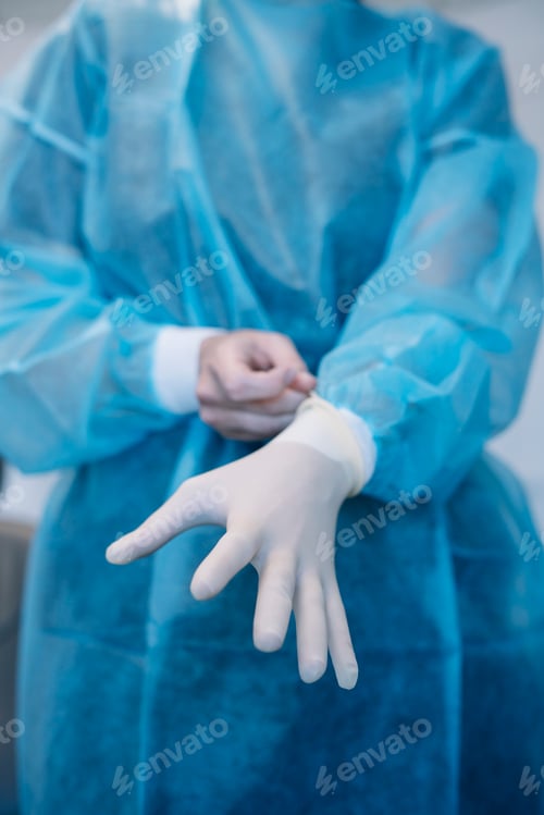 Preview: gloves on the hands of a doctor