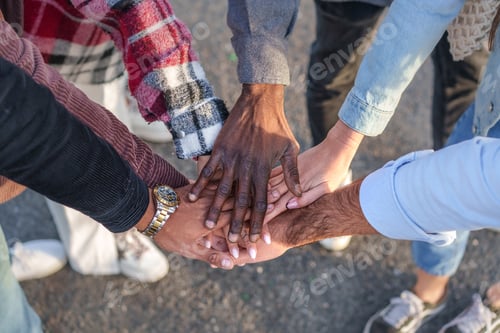 Preview: Unity and diversity in friendship - Multiracial hands locked in friendship