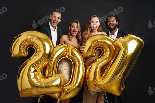Preview: Group of smiling friends celebrating New Year