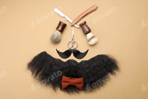 Preview: Artificial moustache, beard and barber tools on beige background, flat lay