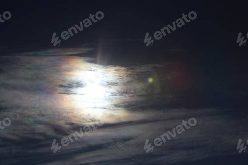 Preview: Brilliantly Colored Iridescent Clouds In A Blue Sunny Sky - Photograph Of A Bright Sun Surrounded