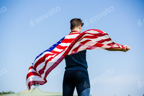 Preview: Athlete holding an american flag