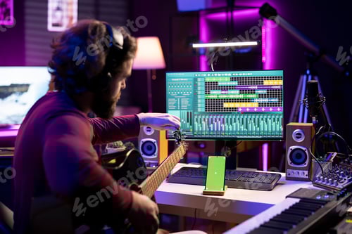 Preview: Man Recording Music in Home Recording Studio