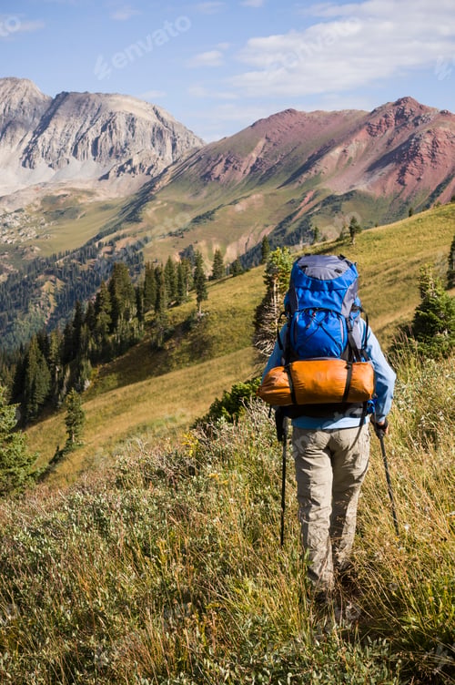 Preview: Woman backpacking in Hasley Basin, West Elk Mountains, Colorado, USA