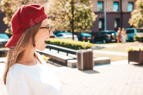 Preview: Young beautiful woman posing in the street
