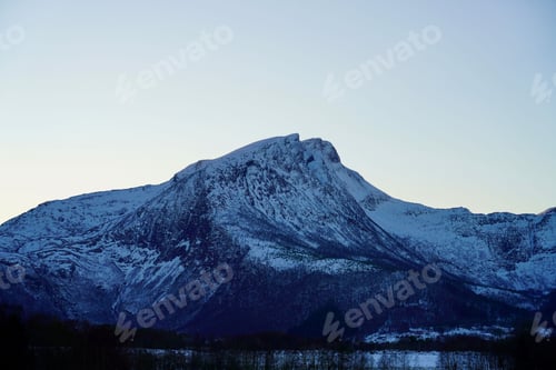 Preview: Snowy Mountain Peak Under Blue Sky