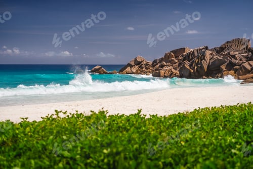 Preview: Ocean waves at Petite Anse, La Digue in Seychelles - Tropical and paradise beach. Luxury vacation