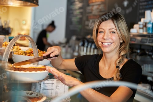 Preview: Waitress Behind Counter In Coffee Shop Cutting Slice Of Cake