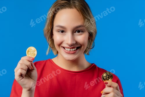 Preview: Woman with bitcoin, crypto currency. Golden coins, blue background.
