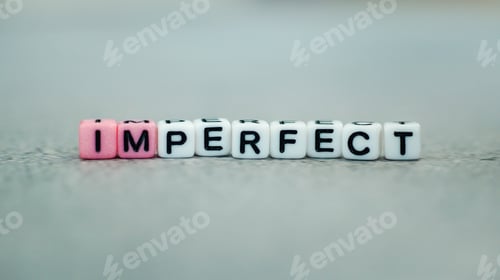 Preview: Imperfect vs. i am perfect slogan written in colorful bead blocks. Self-esteem, confidence concept.