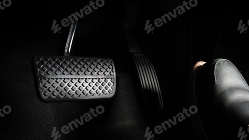 Preview: Close up the foot pressing foot pedal of a car to drive. Accelerator and brake