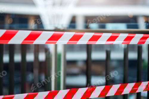 Preview: Red and white warning tape stretched across danger area in the building