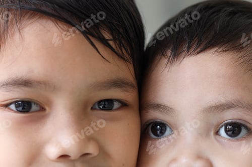 Preview: Close up beautiful eyes of a two young Asian kids