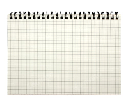 Preview: The notebook has grid lines with a looped spine isolated on white background