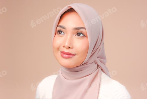 Preview: Close up of a beautiful Asian Muslim woman wearing veil hijab posing and smiling.