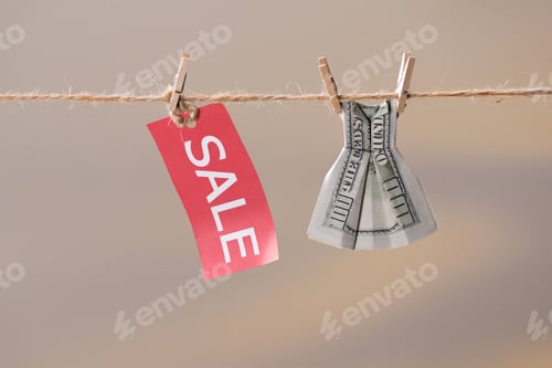 Preview: Dress made of money hanging on clothespin