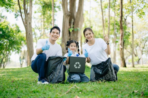 Preview: Asian parents and child collect bottles at the park, sharing love, teamwork, and care. A green