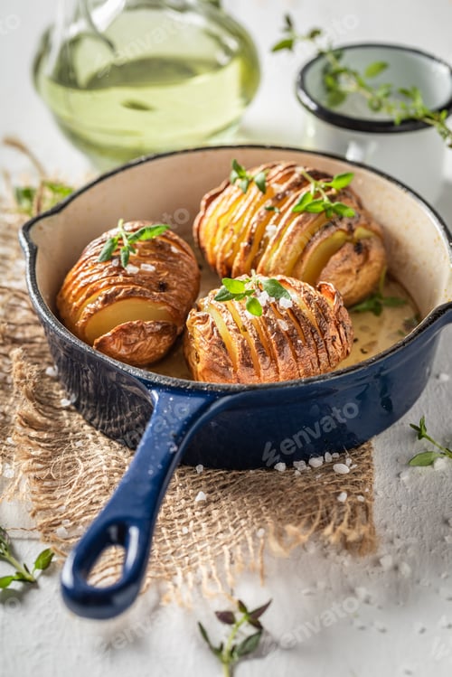 Preview: Delicious baked potatoes with herbs and oil. Scandinavian cuisine.