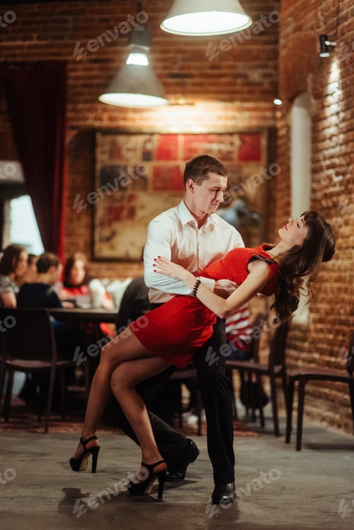 Preview: Dancing young couple on a white background. Passionate salsa.