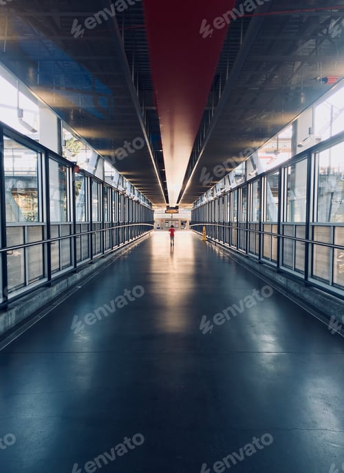 Preview: Boy at end of tunnel at airport