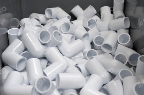 Preview: Many White PVC Pipes and Connectors Close Up