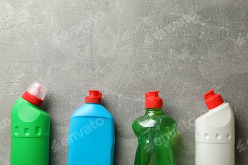 Preview: Bottles with detergent on gray background, space for text