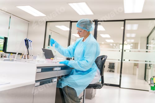Preview: Laboratory technician conducting experiments in a modern lab during daytime
