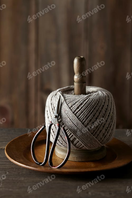 Preview: still life of ball of string and scissors