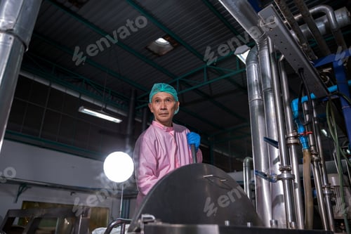 Preview: Worker Checking quality or checking stock of glass bottle in beverage factory.