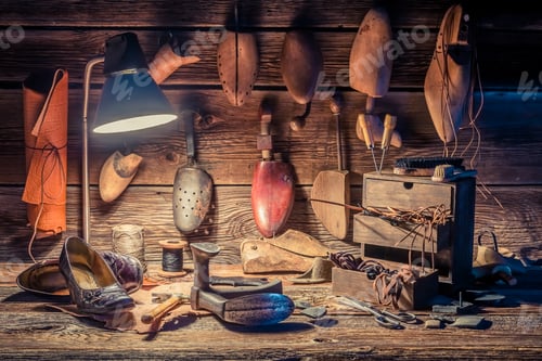 Preview: Vintage shoemaker workplace with brush, shoes and shoelaces