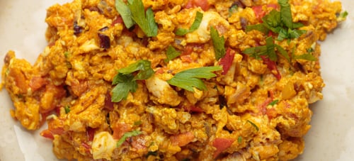 Preview: Close up of akuri indian style scrambled eggs with spices and herbs top view
