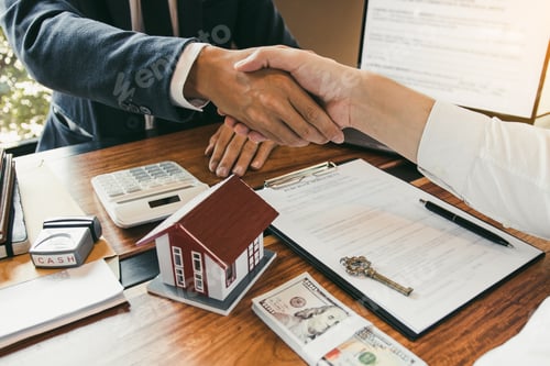 Preview: Home sales agents and buyers work on signing new homes and shaking hands.