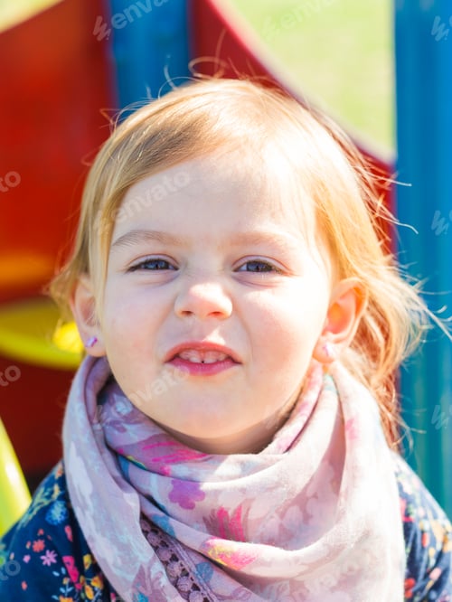 Preview: Cute smiling baby girl outdoors