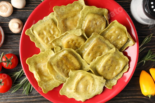 Preview: Delicious Ravioli on a Red Plate on Wood Table