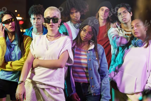 Preview: Modern teenager friends with trendy funky clothes in the city at night