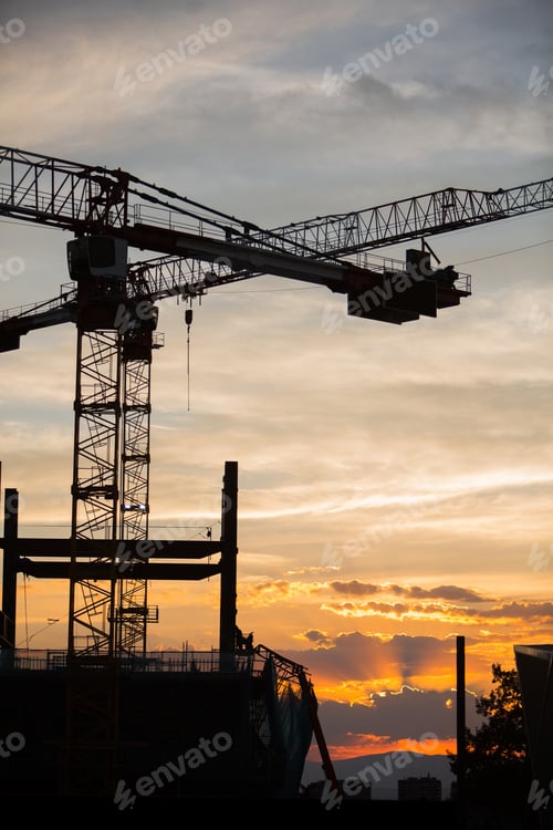 Preview: Silhouette of the construction site on sunset background
