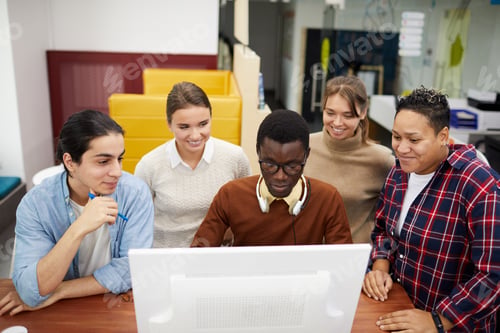 Preview: Group of Students using Internet in Library